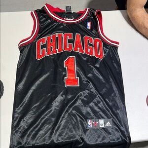 Adidas Black and Red NBA Chicago Bulls Game Jersey Used in excellent conditions.